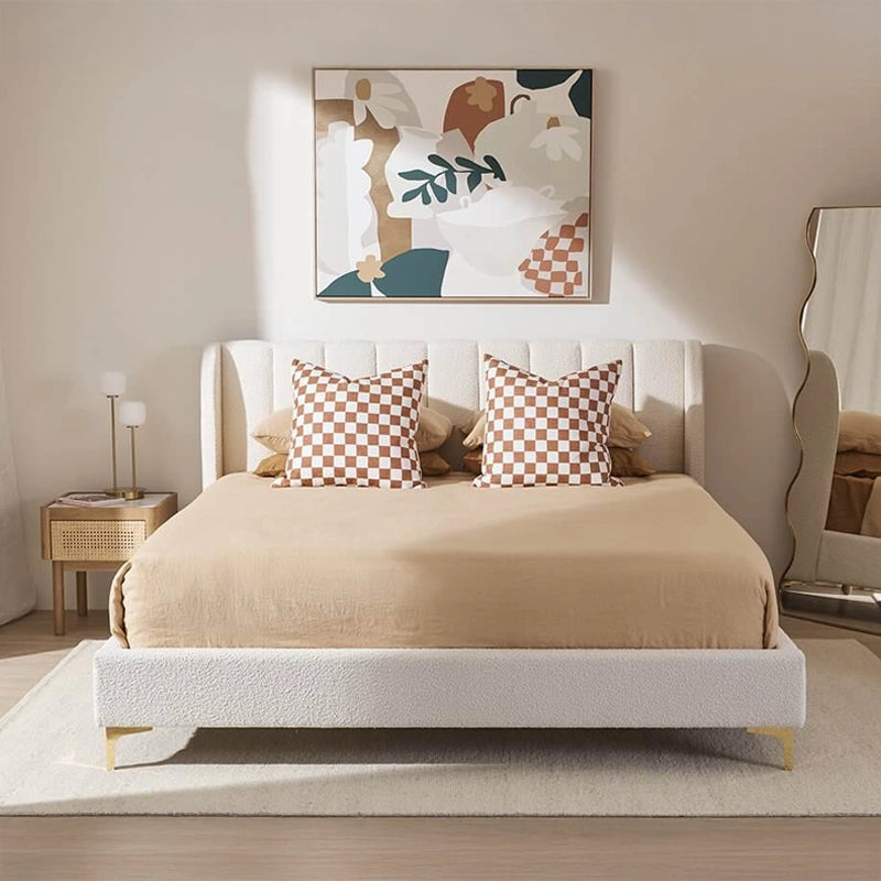 This upholstered bed combines a glamorous hotel-inspired shape with everyday practicality.