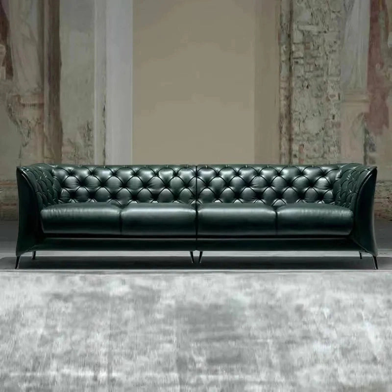 This rectilinear leather settee blends the structured elegance of a classic Chesterfield with the minimalism of modern silhouettes