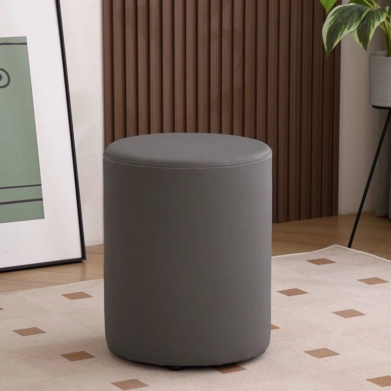 Designer ottoman photo in grey faux leather with pouffe seat and footstool function