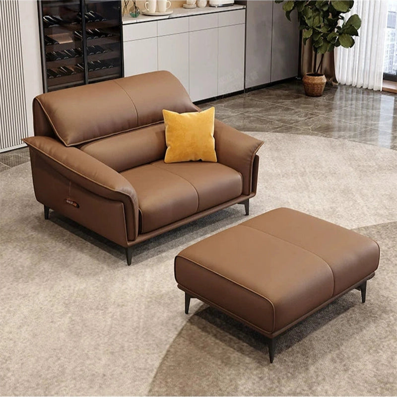 Upholstered in premium pure leather, the L-shaped silhouette is accentuated by smooth contouring, adjustable headrests, and wide flared arms.