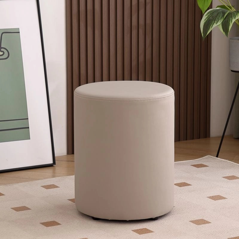 This versatile ottoman seat, sometimes called a pouf or footrest, is suitable for family spaces, kid-safe setups, and apartment living.