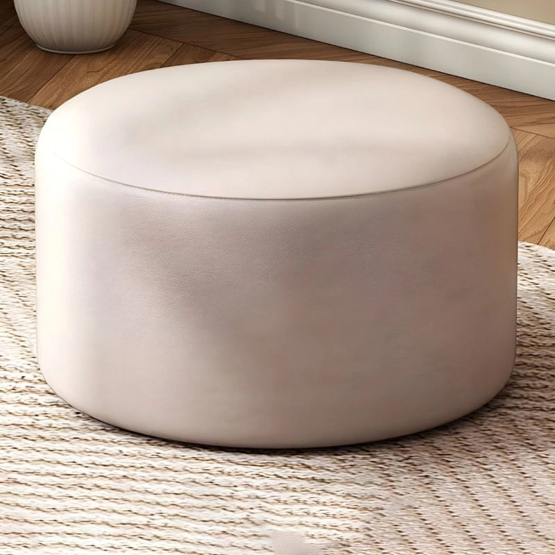 A soft seat that doubles as a coffee-table stand-in or robot-vac friendly accent, this pouffe ottoman also fits transitional styling. 