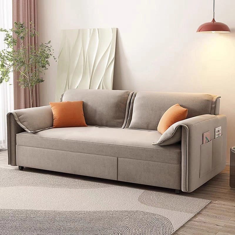 Featuring a pullout ottoman and side storage pockets, this convertible sofa bed aligns style with practical needs.