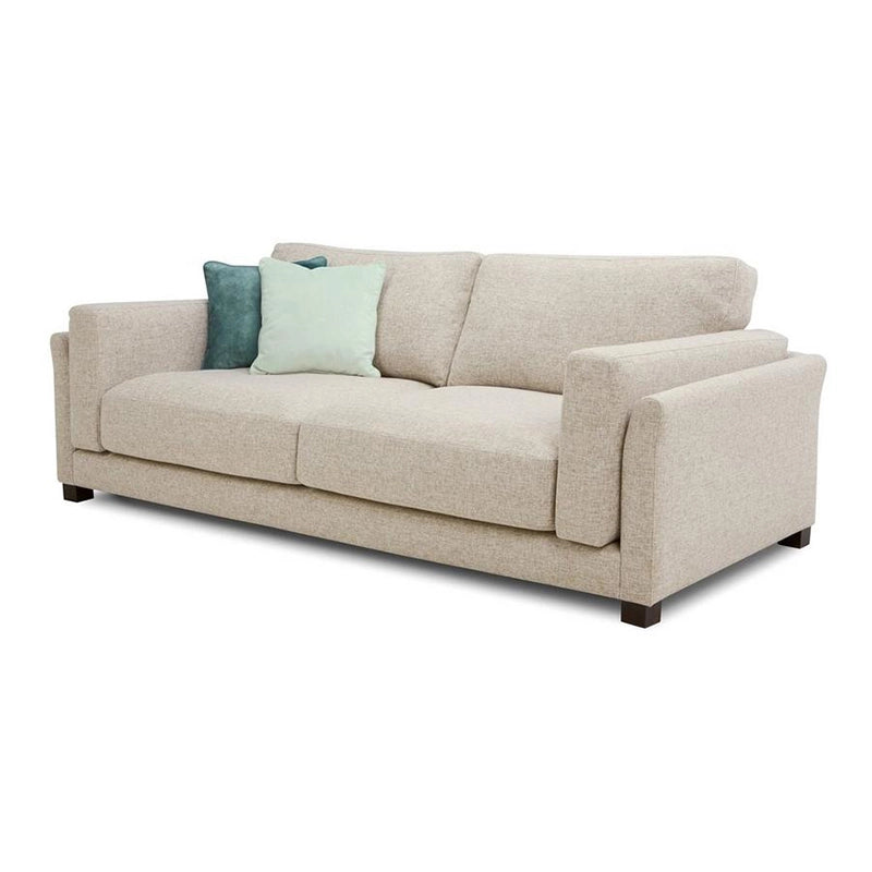 Its sleek silhouette is softened by plush cushions and pastel velvet accents, making it a perfect lounge sofa for compact apartments or formal living rooms.