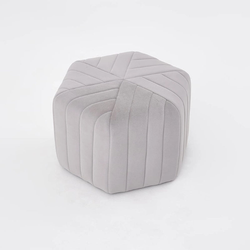 This versatile ottoman functions effortlessly as a footstool, footrest, or pouffe seat, while its bold sculptural design and radial stitching bring a sophisticated edge to any living room ottoman setup.