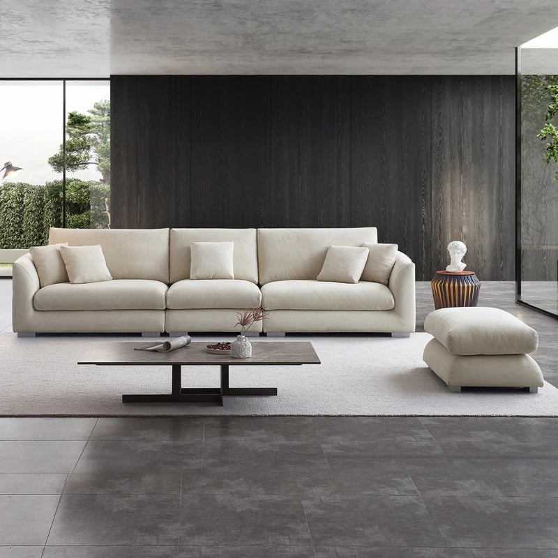 Designed in a neutral beige shade, it includes corner couch and settee-style comfort features such as removable cushions, rounded edges, and a deep seat. 