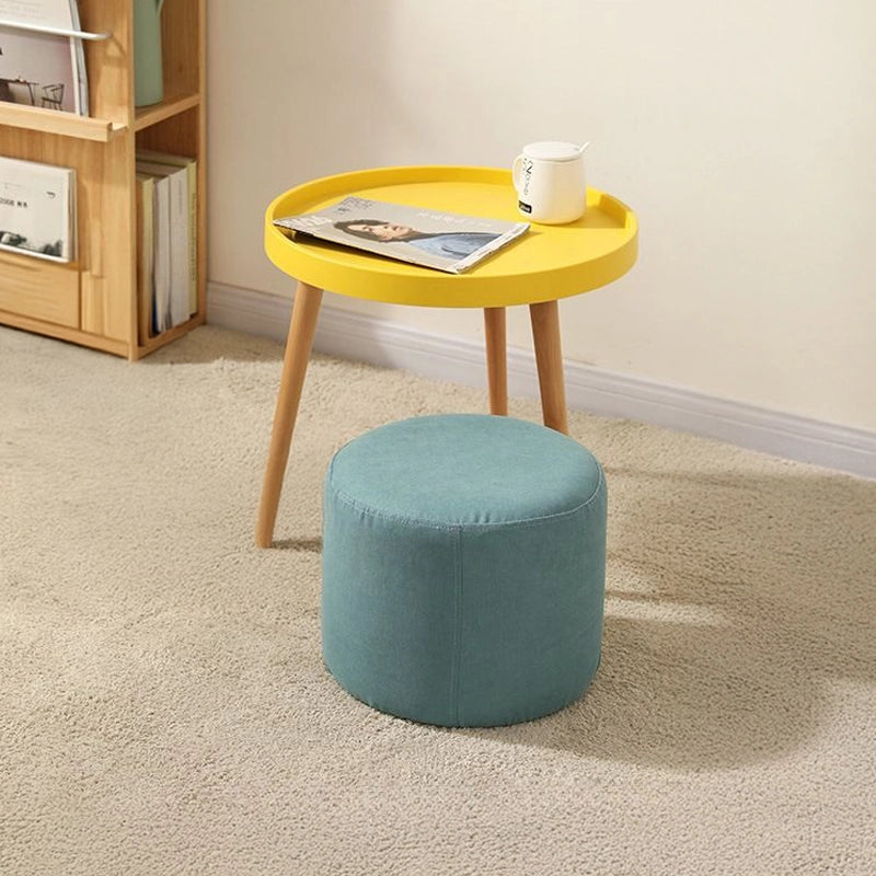 Cylindrical mint green ottoman design with pouf ottoman and footrest in fabric finish