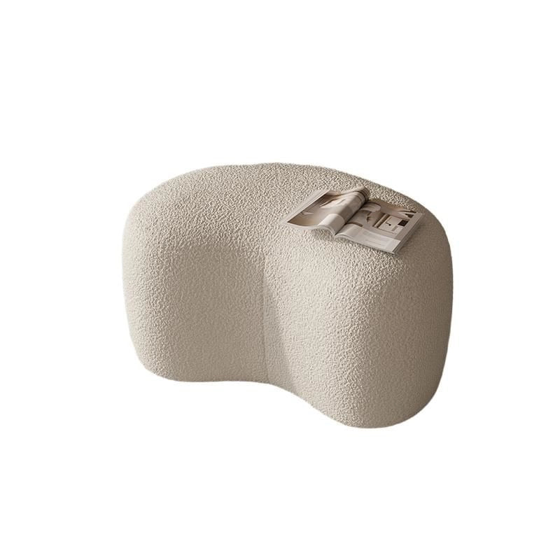 Soft sculptural pouffe ottoman styled with fabric ottoman and pouffe stool in off white