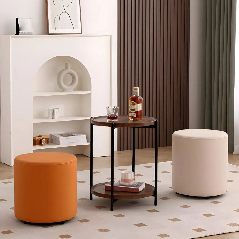 Crafted in a clean cylindrical silhouette, this pouffe ottoman combines style and function in a compact form.
