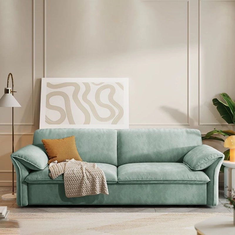 Unfolded bed image with seafoam upholstery and sofacumbed construction details