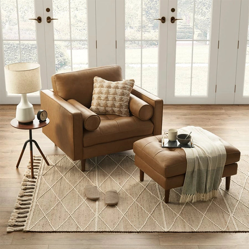 Tapered leg photo showing footrest and leather ottoman with wood base