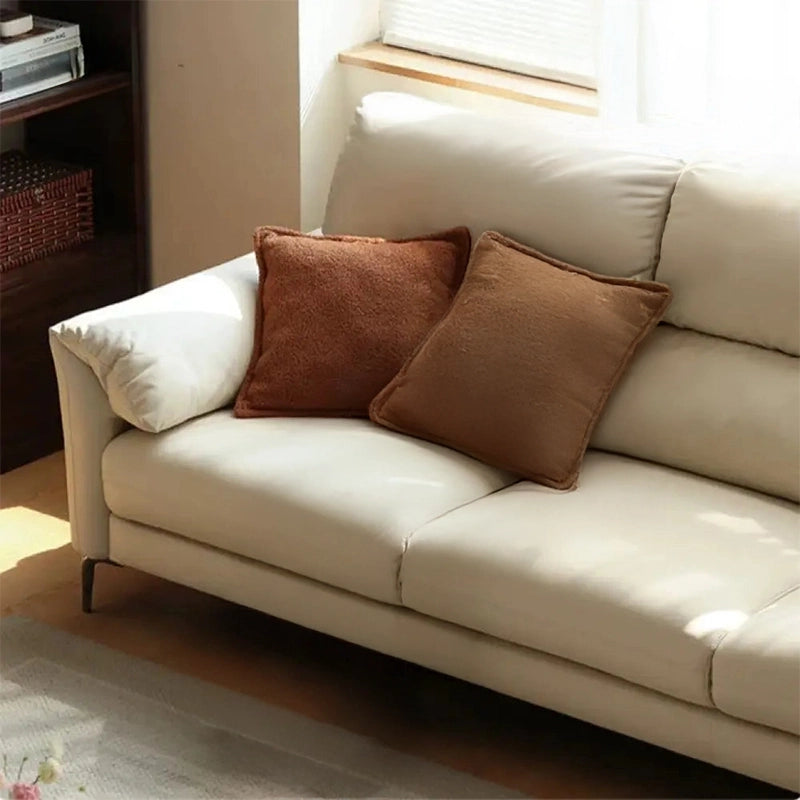 Tapered metal legs and sculpted profile – design of sofa, settee design, neutral tone