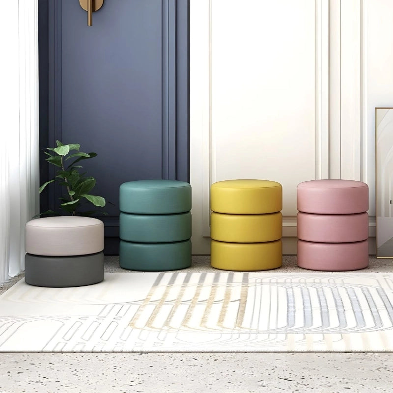 Shaped in a compact circular form with a flat top, it functions effortlessly as a pouffe chair, ottoman seating, or a multipurpose footrest.