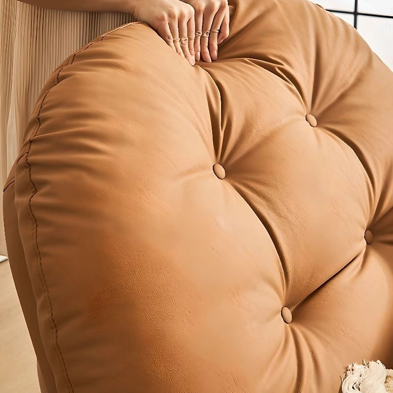  Deeply tufted overstuffed back in tan tone faux leather – recliner, sofa recliner