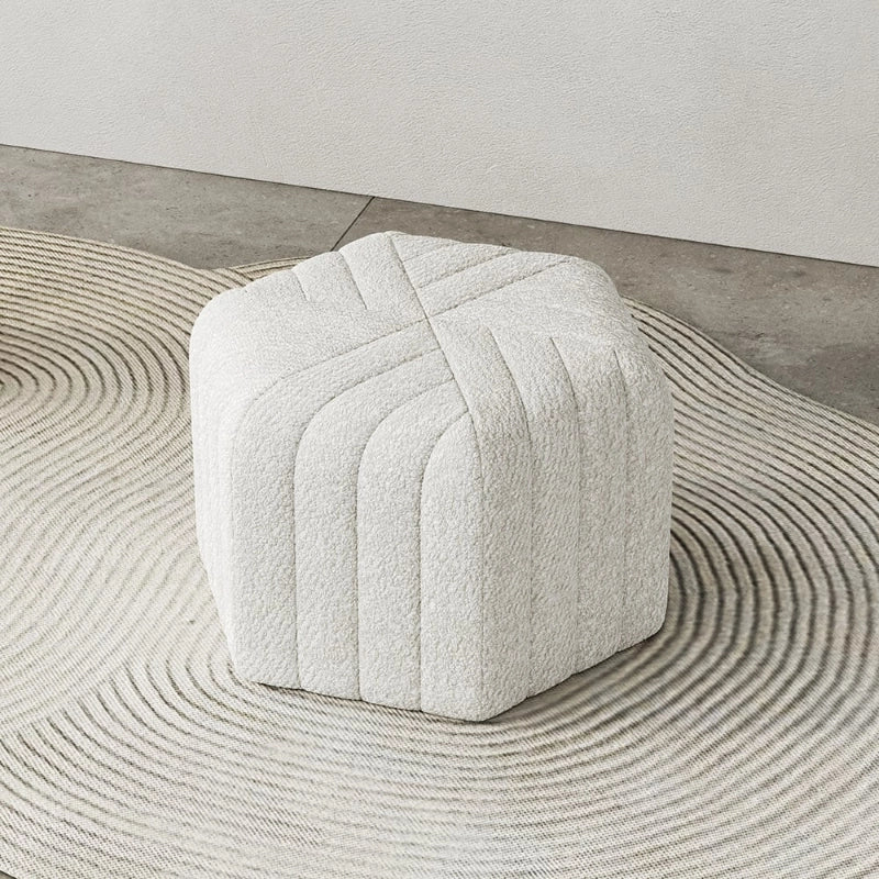 White picture of footstools and ottomans with pouffe ottoman detailing