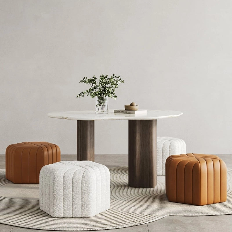 Upholstered in a variety of fabric and leatherette options like matte velvet and boucle, it offers vibrant tones from mustard to blush pink