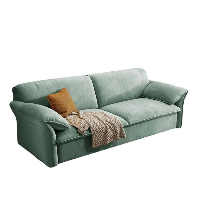 Sofa side profile pic showcasing rounded arms and convertible couch bed features