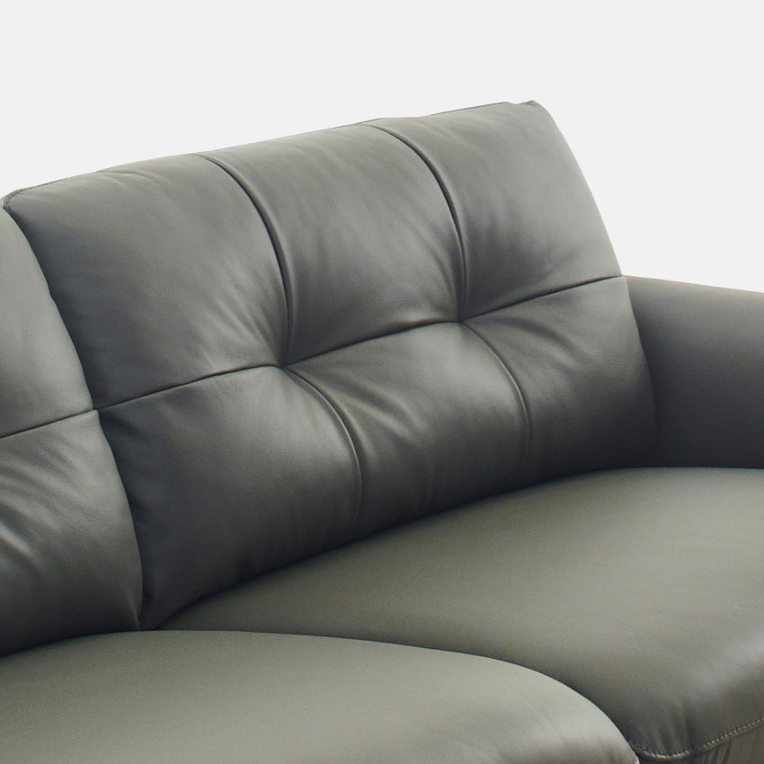 The Heron leather couch blends timeless craftsmanship with modern styling. 