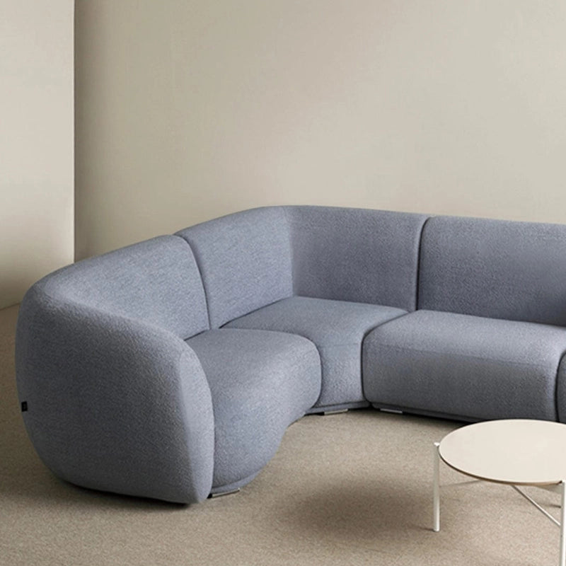 This sculptural settee blends modern artistry and Scandinavian restraint to create a uniquely grounded silhouette - Grey