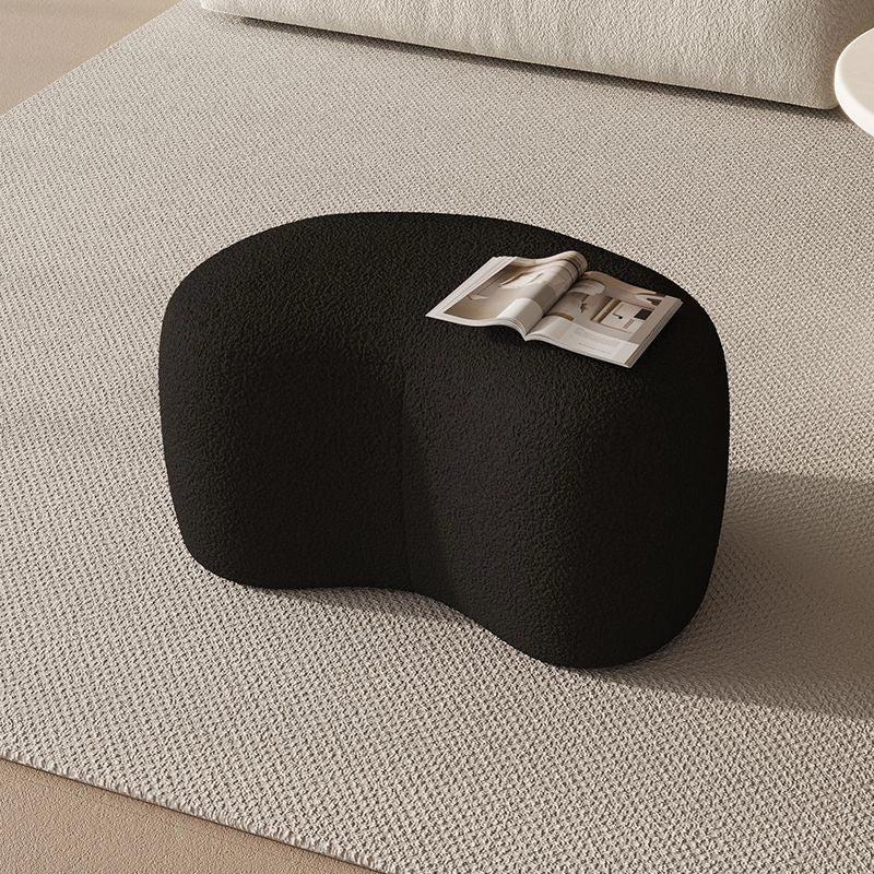 Minimalist footrest profile of pouf ottoman paired with pouffe stool and kid-safe form