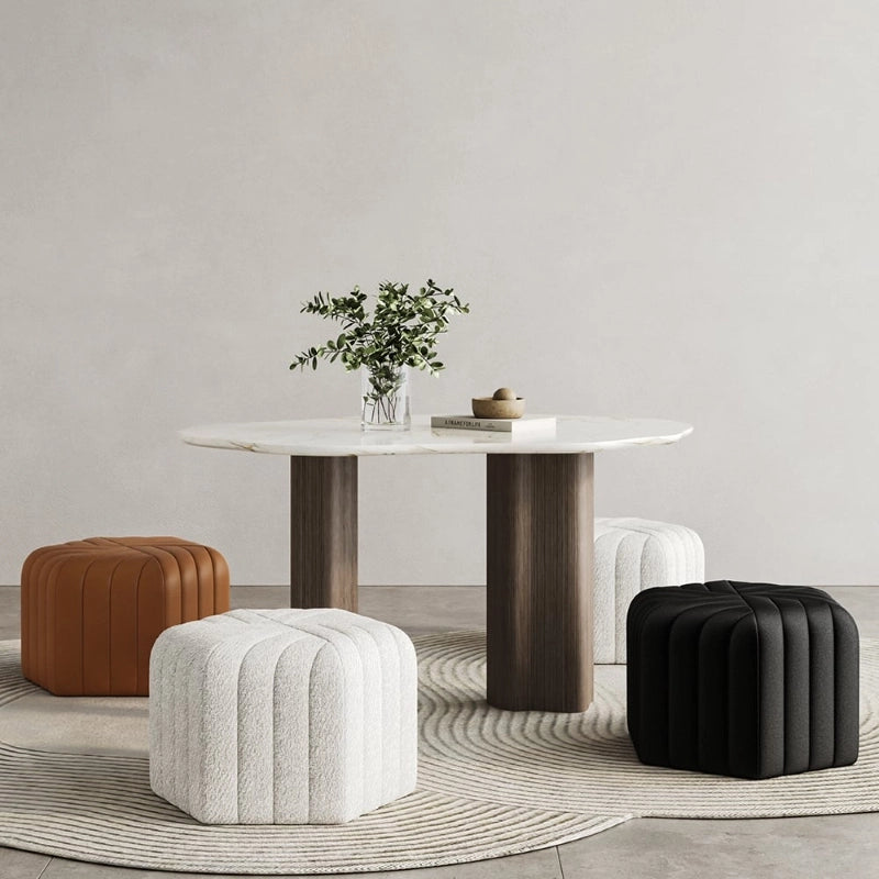 The Ember pouffe ottoman brings bold geometry to compact spaces with its hexagonal structure and artful radial tufting. 