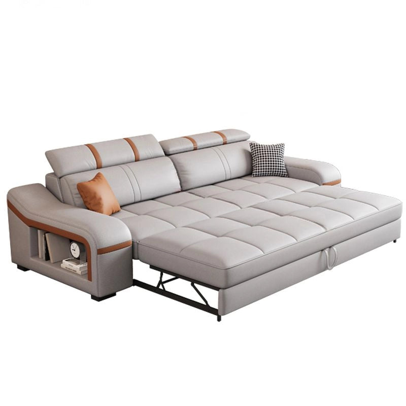 The Maelis is a contemporary l-shaped convertible couch crafted with a durable neem wood frame, upholstered in stylish grey leatherette with camel accents.