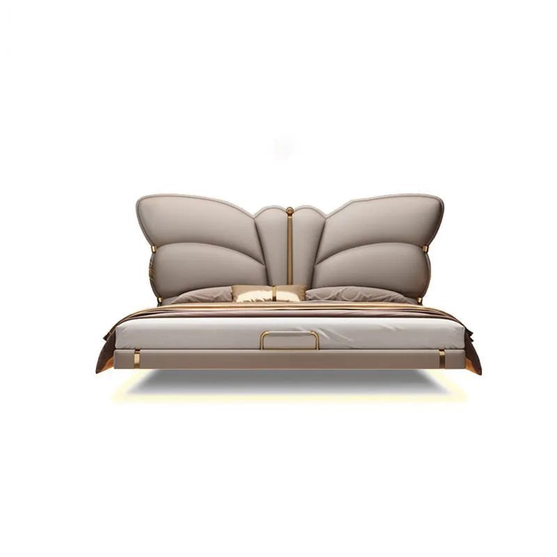 This luxurious upholstered cot blends fantasy and structure through a sculptural butterfly-inspired headboard, making it an iconic bed for king size bedrooms.