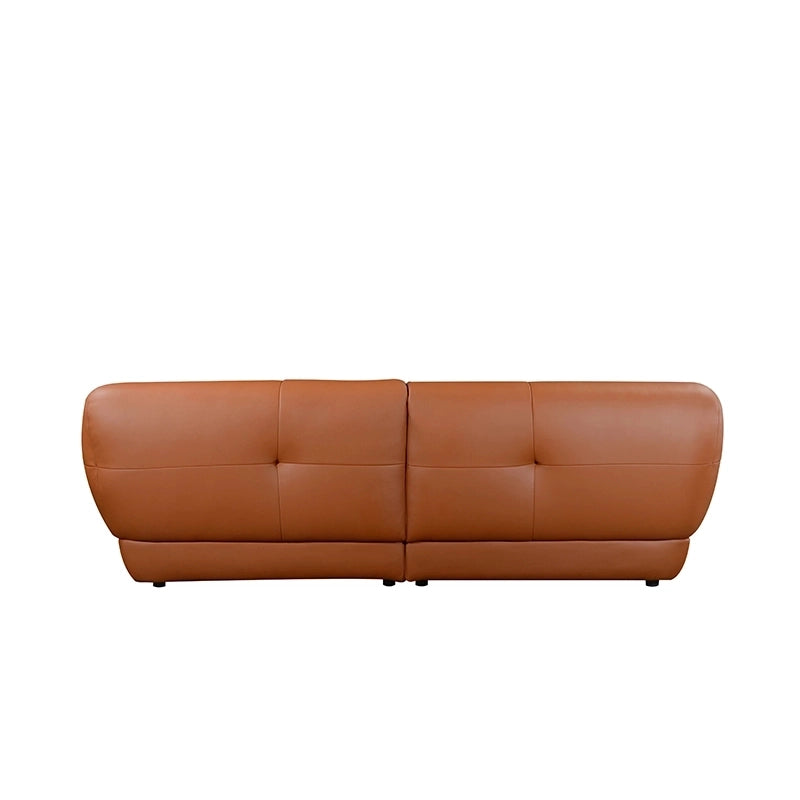This three-seater couch showcases an opulent design with its sculpted, flared arms and grid-style tufting. 