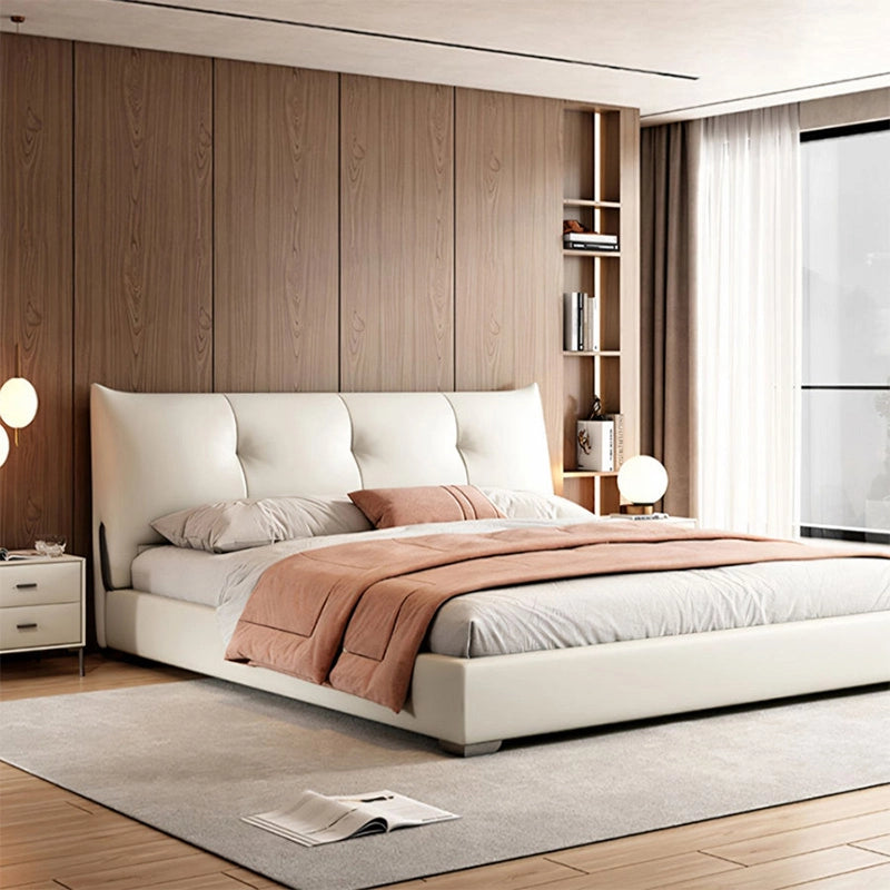 Its ergonomic panelled headboard, softly tufted and cushioned, features a back-lean angle ideal for reading or lounging. 