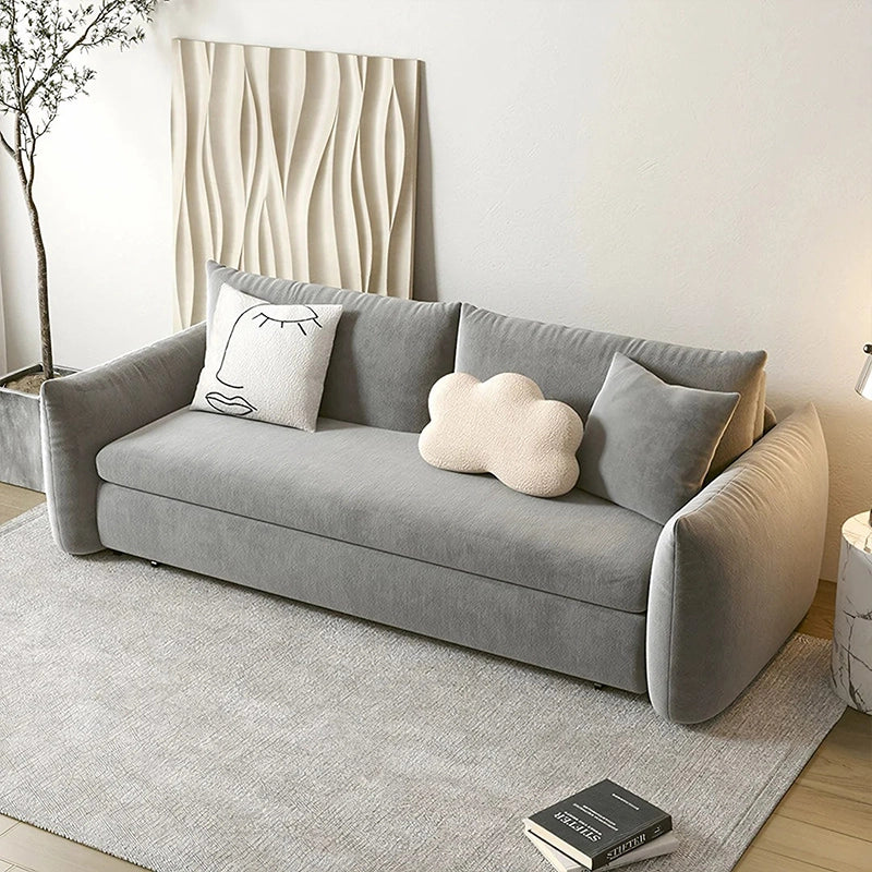 Designed for micro-living, it features a straight 3-seater silhouette, cushioned pillow arms, and a low-profile backrest