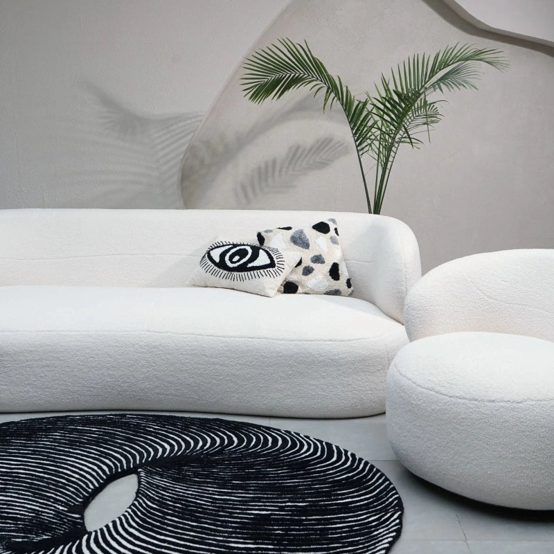 The fabric sofa’s soft boucle upholstery complements Indian interiors, making it a perfect couch or lounge sofa for relaxed evenings