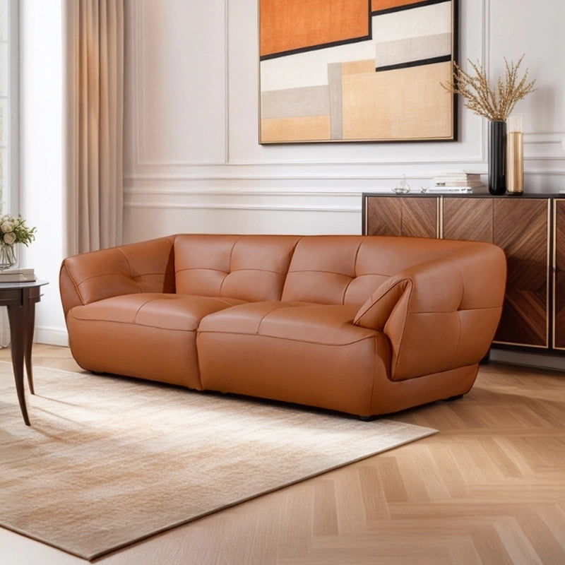 Rounded base leather couch image showing tufted stitching, leather sofa set and settee design