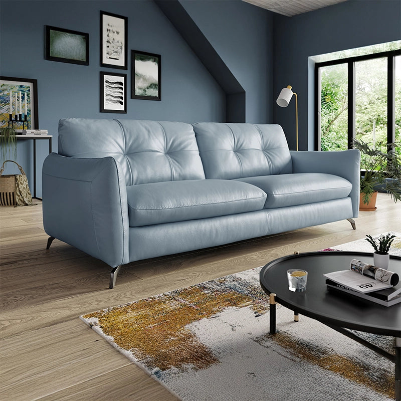 ts refined structure—defined by flared arms, semi-attached backrests with tufted detail, and metal legs—offers ergonomic comfort and contemporary aesthetics.